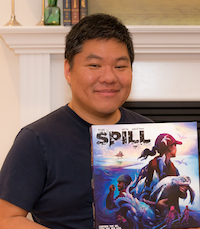 Andy Kim smiling, holding spill, a game of his own design